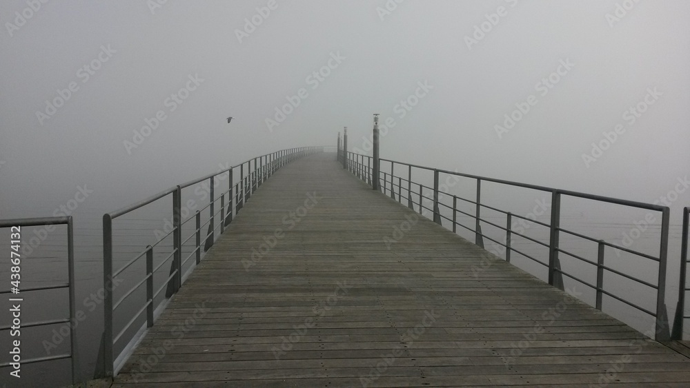 wooden bridge in the fog