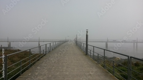 wooden bridge over lake
