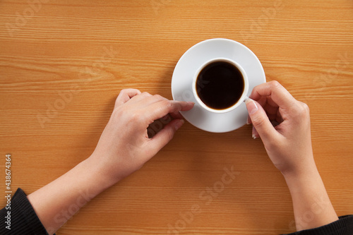 Young woman drinking black coffee.