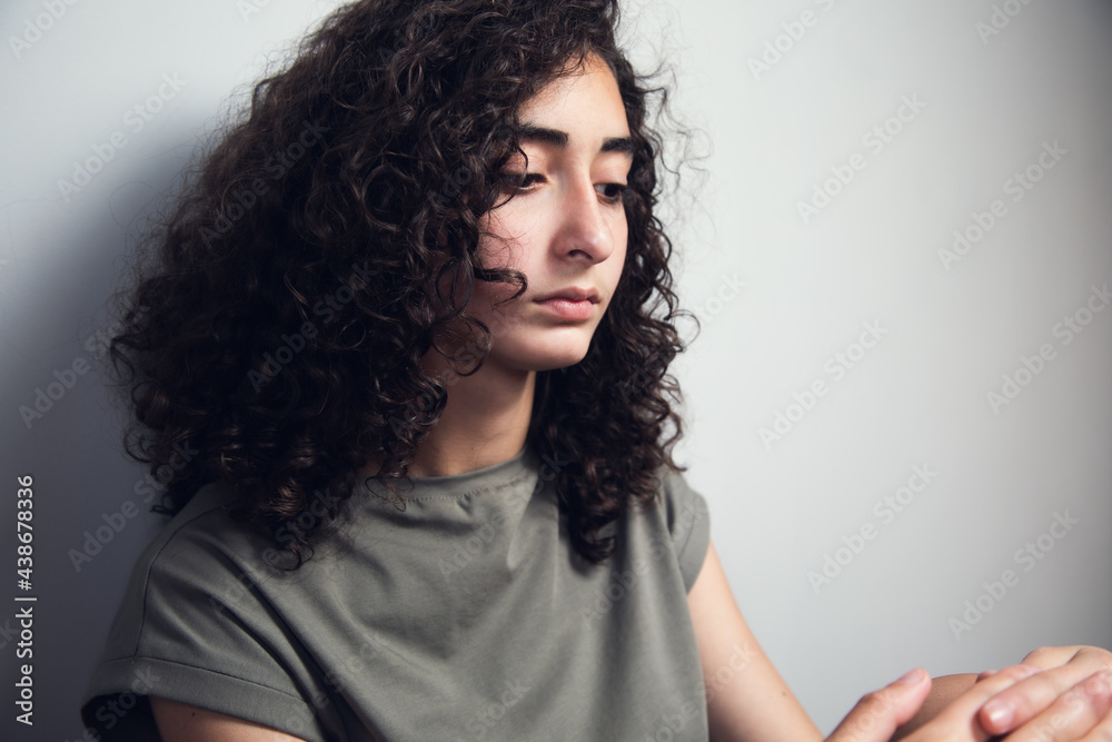young sad woman sitting in ground young sad woman sitting in ground