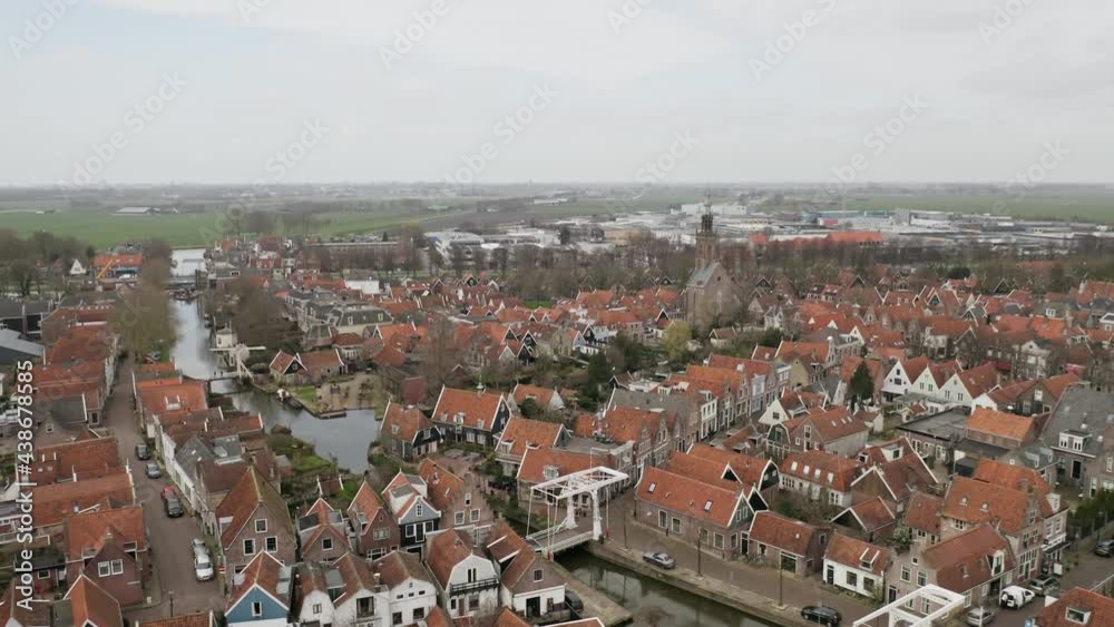 Netherlands Marken flying over a small city in the Netherlands. typical Dutch houses. a flock of birds flies over the city aerial survey Netherlands Marken flying over a small city in the Netherlands. typical Dutch houses. a flock of birds flies over the city aerial survey
