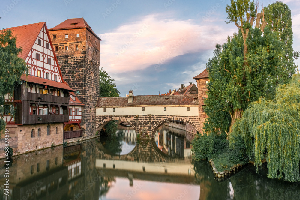 A colourful and picturesque view of the half-timbered old houses on the banks of the Pegnitz river in Nuremberg. A Tourist attractions in Bavaria and Germany