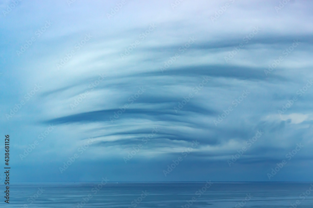 Unusual sky over the sea on a cloudy day. Unusual sky over the sea on a cloudy day.