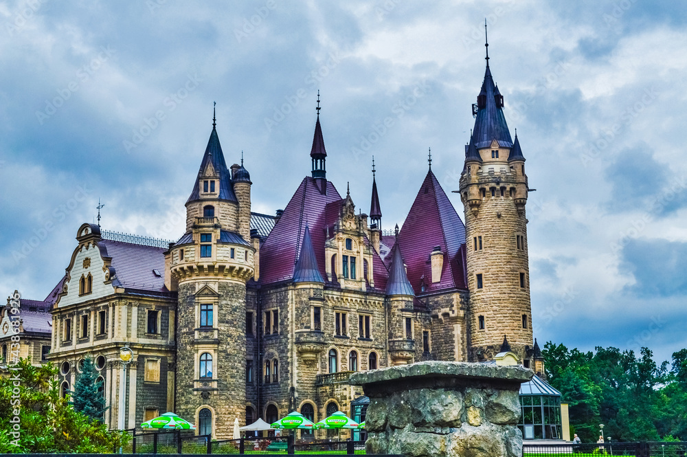 Obraz premium MOSZNA, POLAND, 24 AUGUST 2018: The beautiful Moszna Castle under the clouds