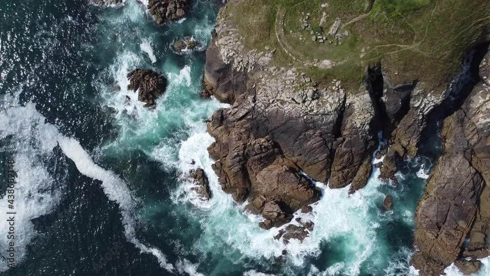 Aerial view of the cliffs with the rough sea in Ferrol, Galicia, Spain. Saint George's beach. Aerial view of the cliffs with the rough sea in Ferrol, Galicia, Spain. Saint George's beach.