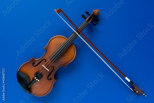 violin and bow on a blue background
