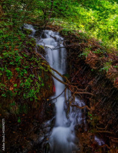 Unnamed waterfall in Ulupinar premium park restaurant. Kemer, Antalya, Turkey. Long exposure picture taken in may 2021 photo