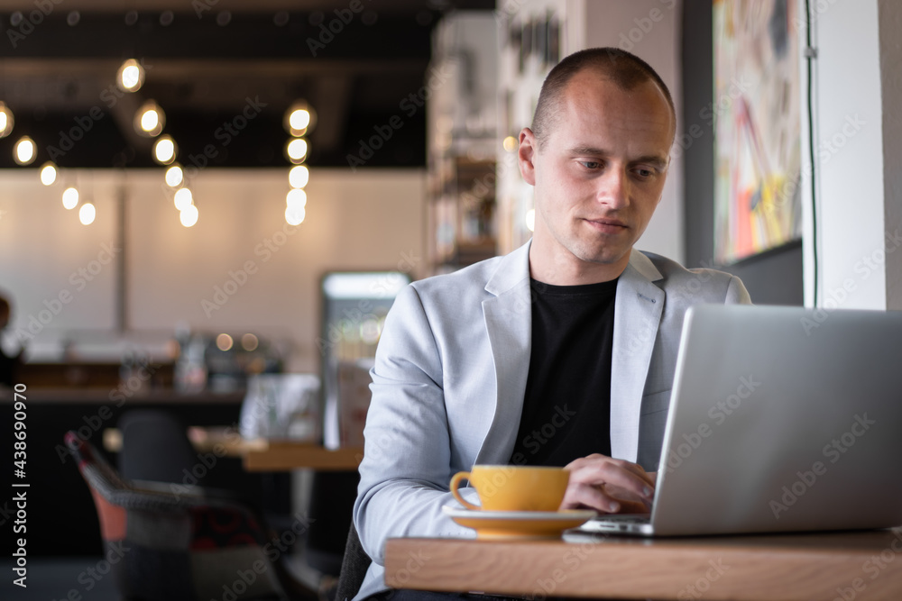 Businessman working laptop office and drinking caffee