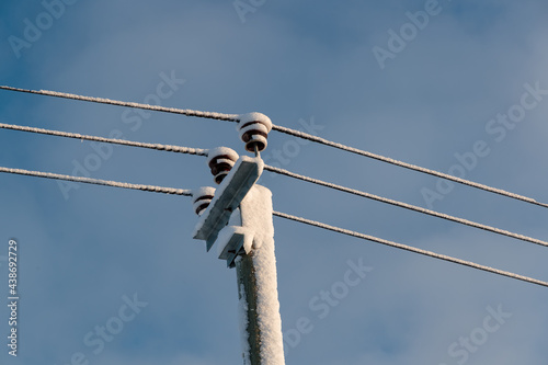 power line poles in winter photo