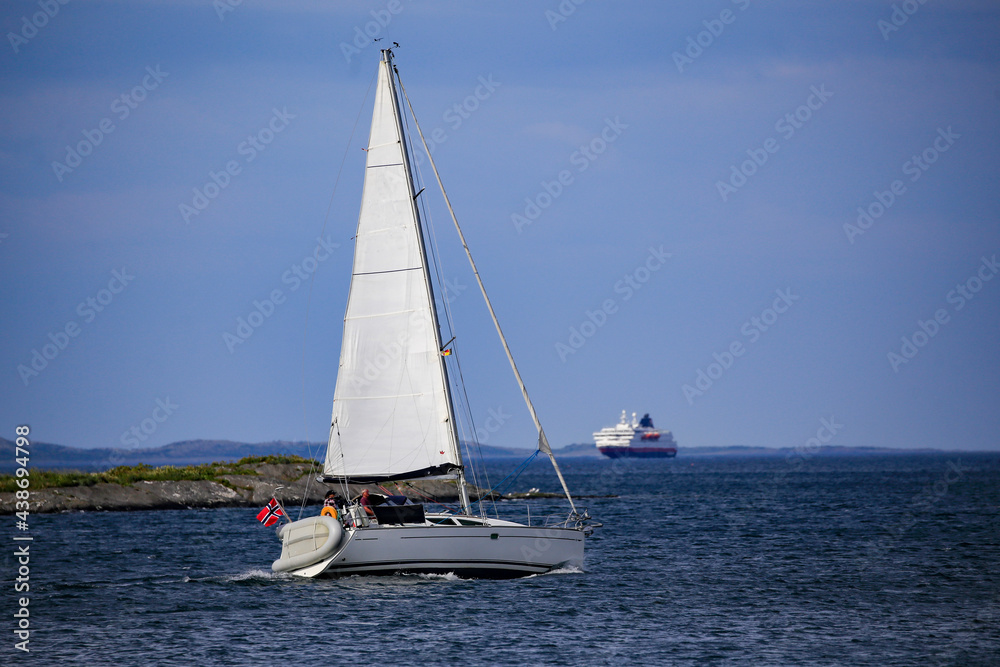 Obraz premium Sailboat with wind in the sails along the Norwegian coastBrønnøysund,Helgeland,Nordland county,Norway,scandinavia,Europe 
