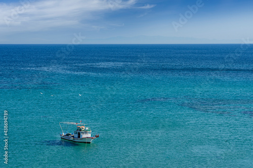 Fishing boat floating on the sea. Aegean Sea - Turkey