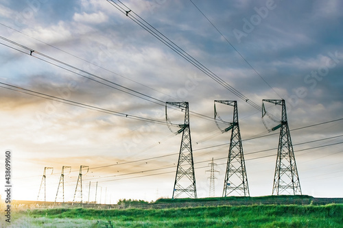 Photos High voltage power line on industrial electricity line tower for electrification