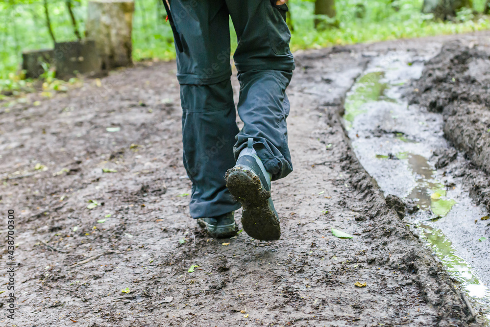 Mud stuck to boots on mountain trails in the forest