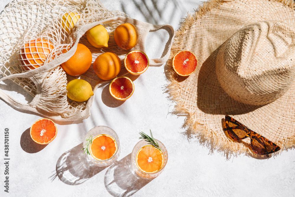 Summer fashion flat lay on white background. Holiday party, vacation,  travel, tropical concept. Straw hat, sunglasses, refreshing drinks and  citrus fruits. Palm shadow and sunlight, sun. Top view. Stock Photo | Adobe