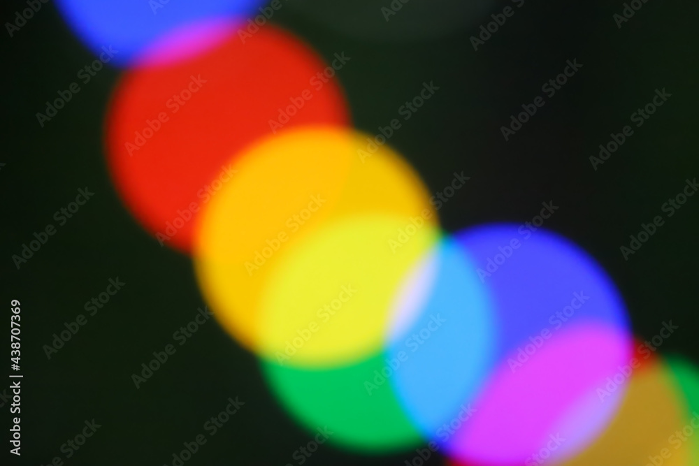String of blurred multicolored holiday lights String of blurred multicolored holiday lights
