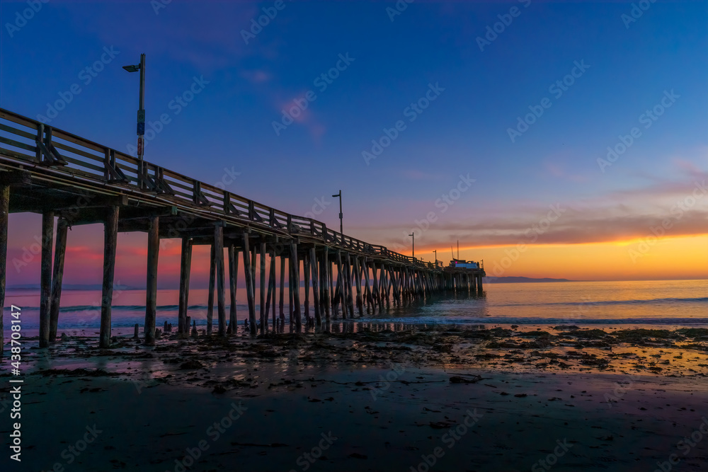 The Captiola, CA pier at sunset at the beach The Captiola, CA pier at sunset at the beach
