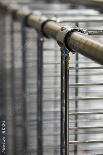 Detail of the legs of a metal rack.