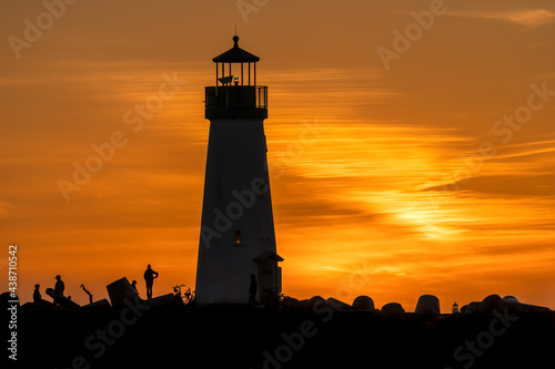 The Walton Lighthouse at the Santa Cruz, CA harbor at sunset. photo