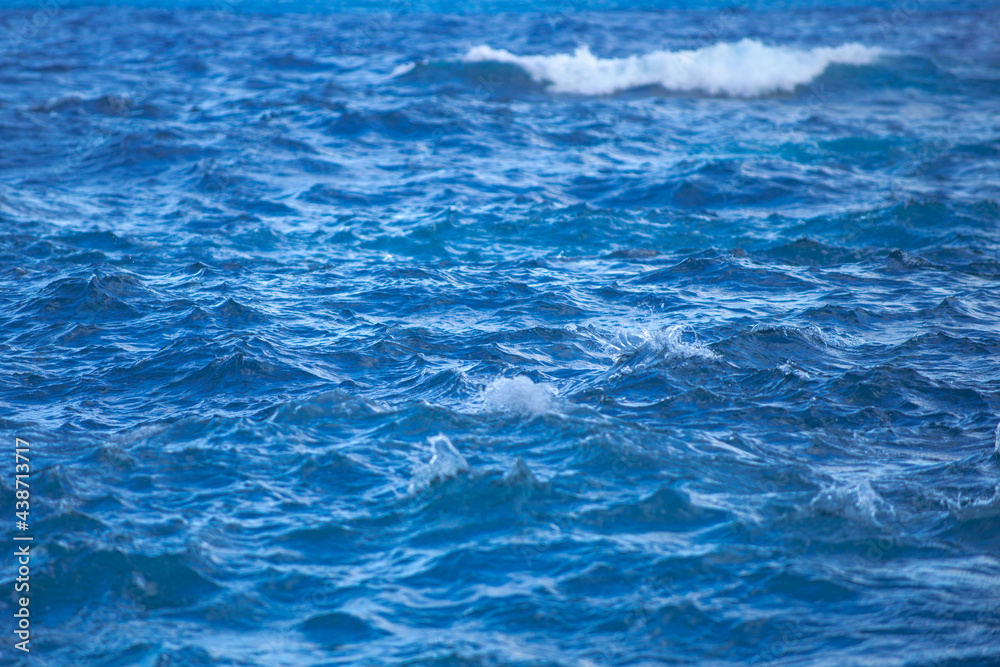 Calm sea water surface texture with splashes and waves. Abstract nature background. Background of aqua ocean water surface. Calm sea water surface texture with splashes and waves. Abstract nature background. Background of aqua ocean water surface.