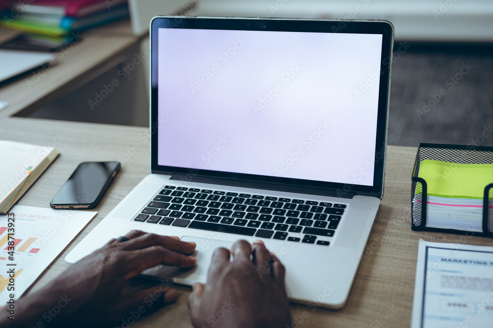 African american businessman sitting at desk using laptop having video call African american businessman sitting at desk using laptop having video call