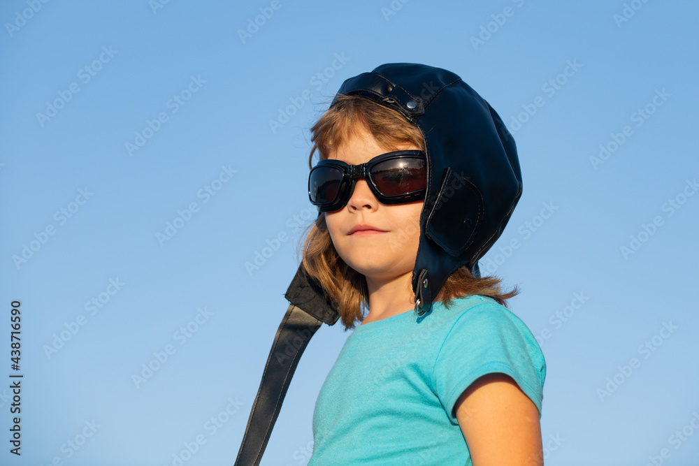 Kids with pilot helmet and glasses, close up head portrait of cute child. Kids dream. Kids with pilot helmet and glasses, close up head portrait of cute child. Kids dream.