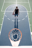 Basketball player, top view. Man playing basketball, above hoop of man shooting basketball.