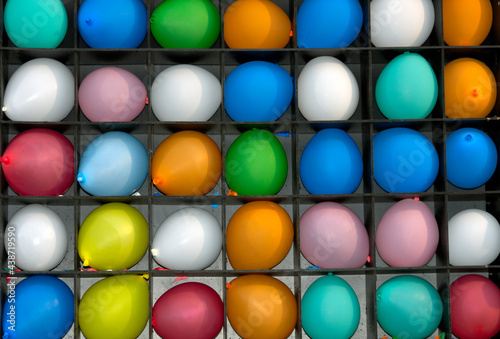 Pattern of colourful baloons in shelves