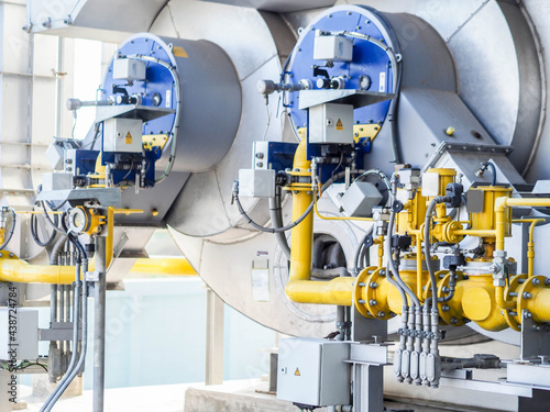 фотографія Auxiliary boiler systems from natural gas which include stack, burner, boiler and sky in power plant