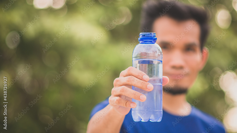 Close up hand holding bottle water drink Close up hand holding bottle water drink