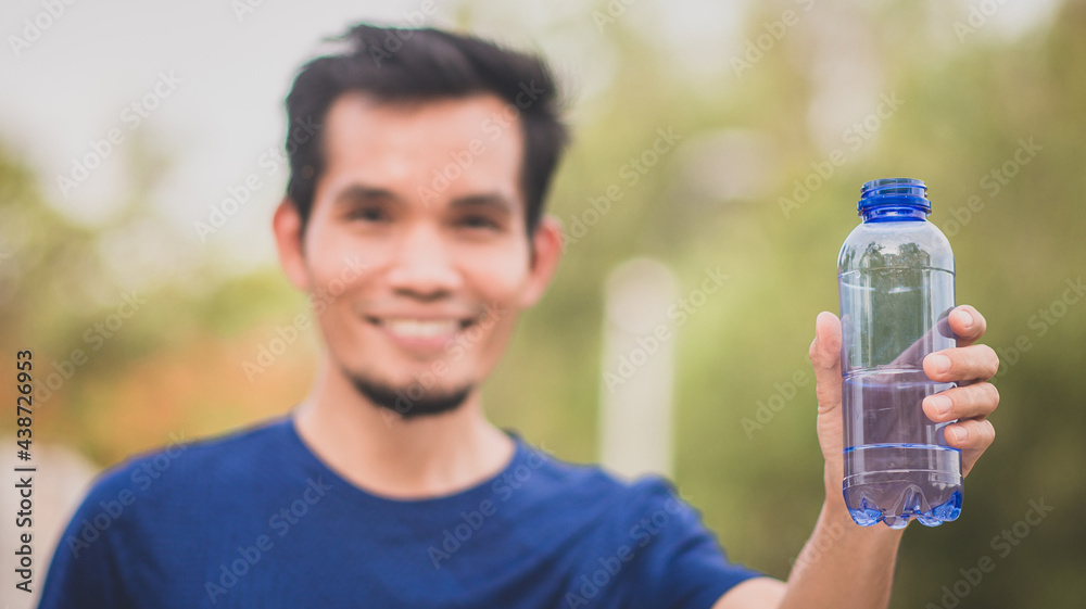Runner drinking water after running Runner drinking water after running