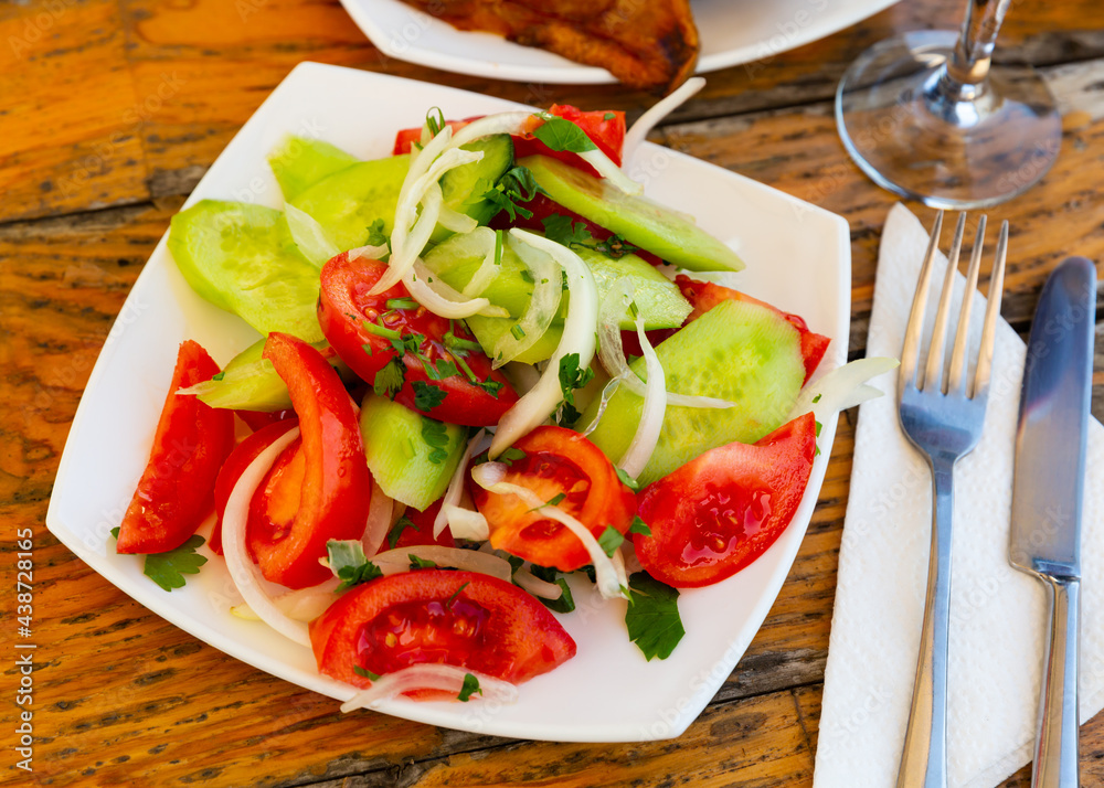 Fresh vegetable salad with tomatoes and cucumber
