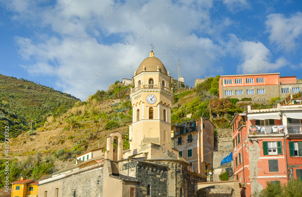 The Santa Margherita di Antiochia Church with it's bell tower and clock at the village of Vernazza, Cinque Terre Italy