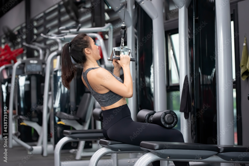 Asian woman workout Close Grip Lat Pull Down in Fitness gym Asian woman workout Close Grip Lat Pull Down in Fitness gym