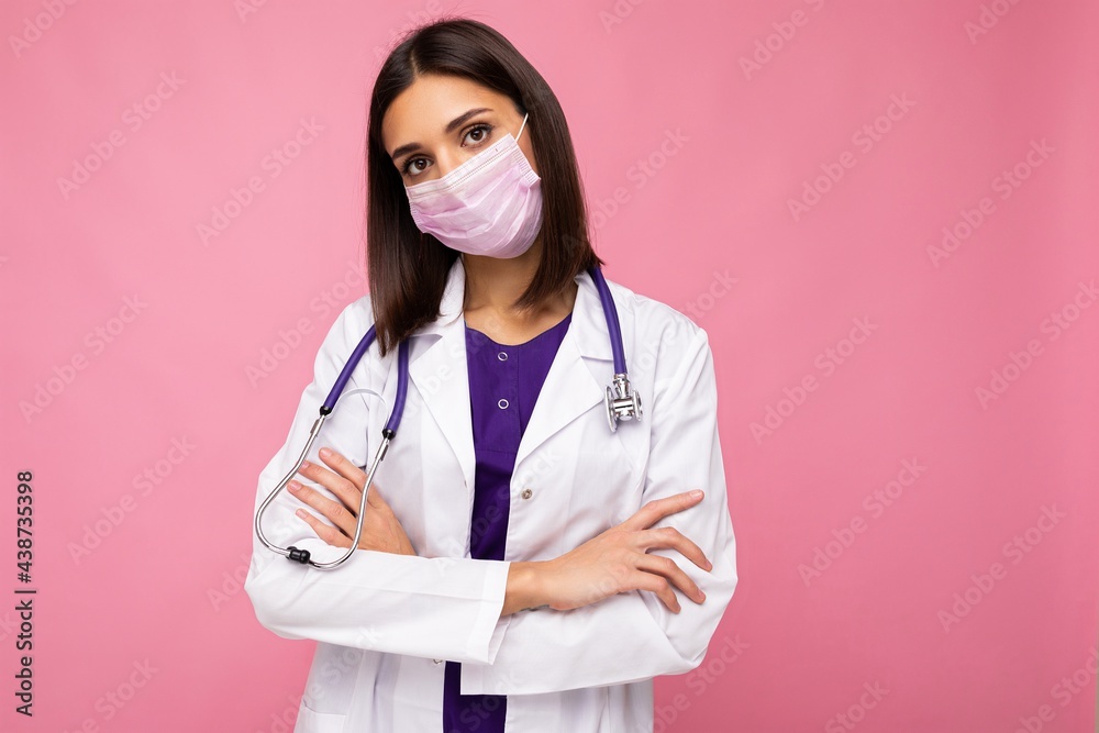Covid19, coronavirus, healthcare and doctors concept. Portrait of professional confident young european doctor in medical mask and white coat, stethoscope over neck