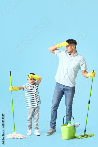 Tired father and son with c...