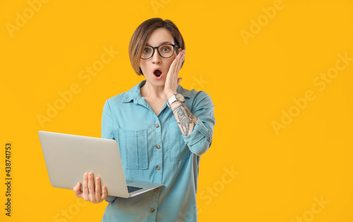 Shocked female programmer w...
