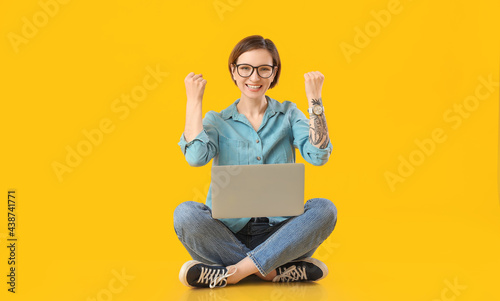 Happy female programmer wit...