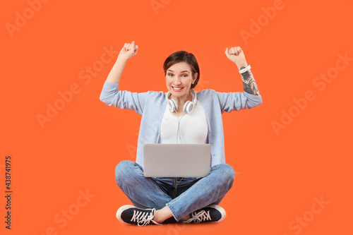 Happy female programmer wit...
