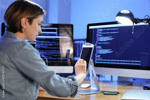 Female programmer using tab...