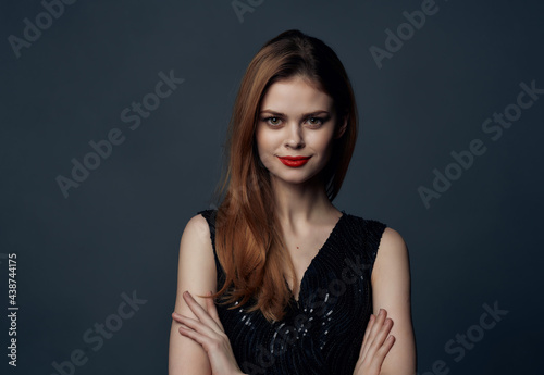 attractive woman in black dress cosmetics red lips charm glamor dark background