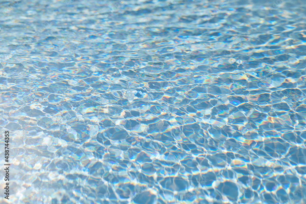 Bright blue aqua surface in sunny day, seamless pattern, texture. Natural background with bokeh lights. High quality photo Bright blue aqua surface in sunny day, seamless pattern, texture. Natural background with bokeh lights. High quality photo