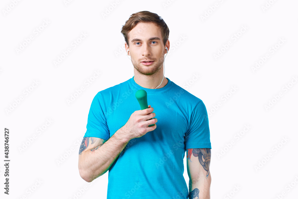 man with dumbbells in hands in headphones fitness exercise man with dumbbells in hands in headphones fitness exercise