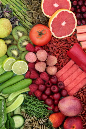 Green and red high fibre food for for good digestive health with fruit, vegetables and pasta. Foods also high in antioxidants, minerals, lycopene, smart carbs and vitamins. Health care concept. 