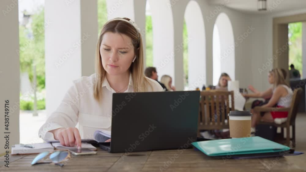 Business woman with calculator and laptop counts incomes, expenses or taxes, RED Business woman with calculator and laptop counts incomes, expenses or taxes, RED