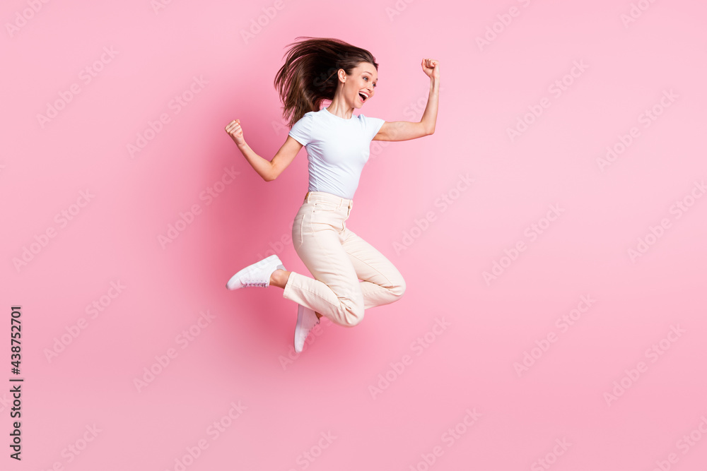 Full size profile photo of hooray nice brunette hair lady jump wear t-shirt pants isolated on pink background