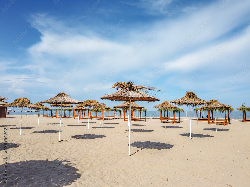 Beach with umbrellas at the Bulgarian Black Sea coast.Burgas Beach.