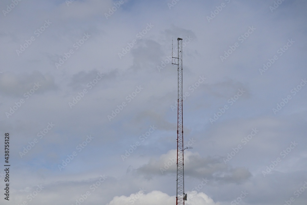 Telecommunication tower with a blue background Sky antenna Radio and satellite Communication technology. Telecommunications industry Mobile network or telecommunications 4g Telecommunication tower with a blue background Sky antenna Radio and satellite Communication technology. Telecommunications industry Mobile network or telecommunications 4g