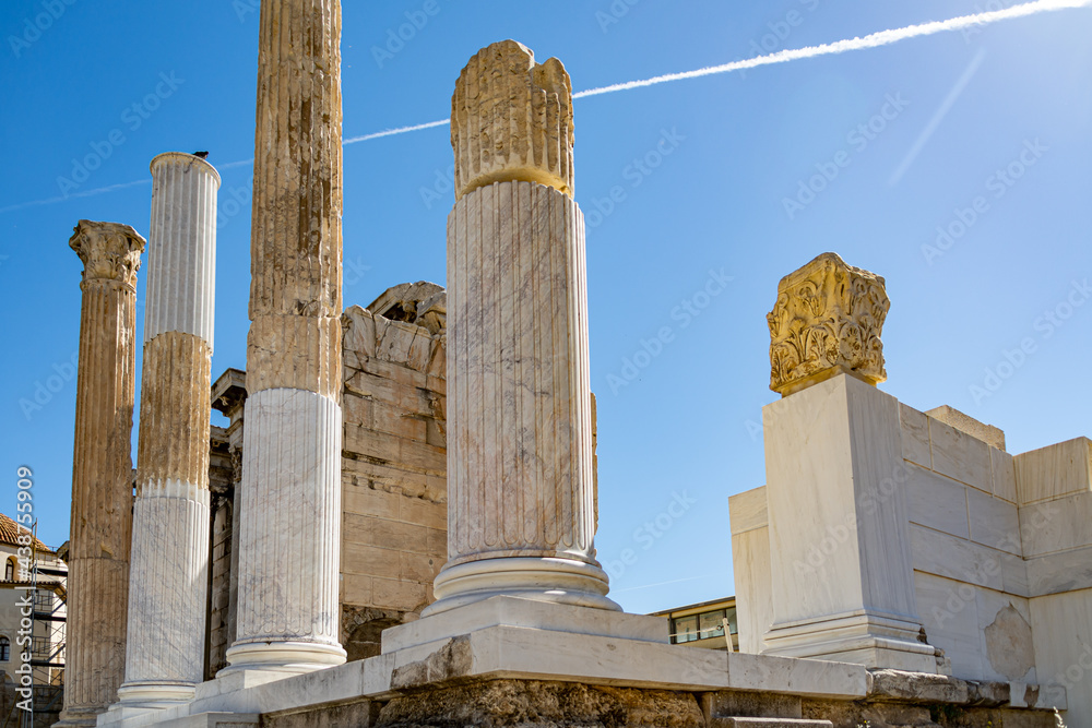 Old Entrance to the Hadrian's Library on the north side of the Acropolis of Athens, Greece against the sun and blue sky