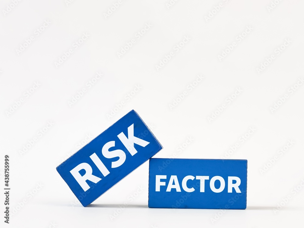 Blue wooden blocks written risk factor isolated on white background. Business and economy concept. Blue wooden blocks written risk factor isolated on white background. Business and economy concept.
