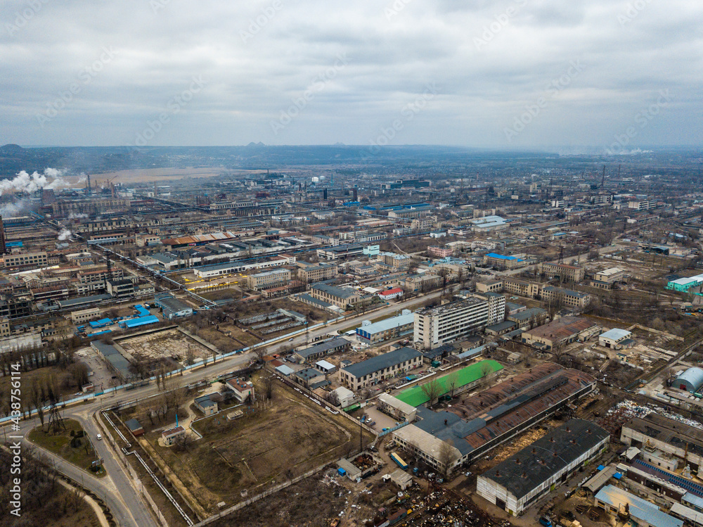 Aerial view from drone of industrial zone with fuming chimneys. Chemical plant